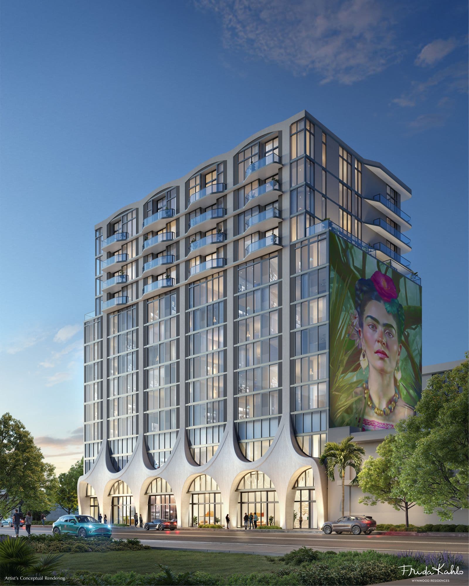 The building, with its arched base and a Frida Kahlo mural